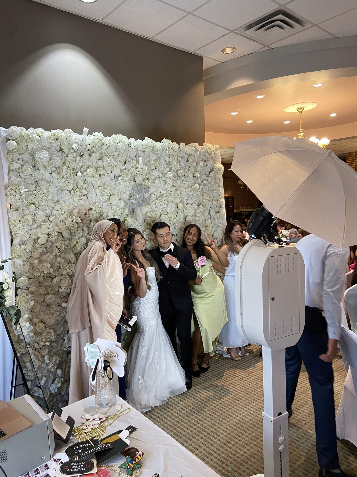 Luxury floral wall photo booth at a wedding